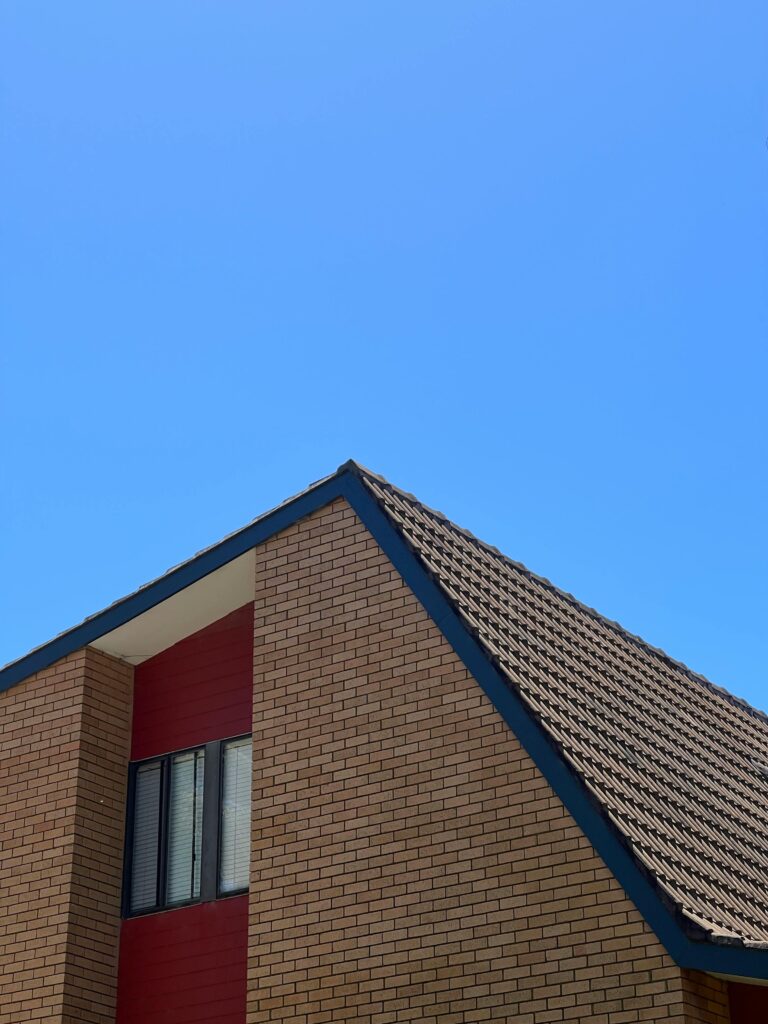 pexels-photo-14257340-14257340 A minimalist view of a modern building facade against a clear blue sky in North Wollongong, NSW, Australia.